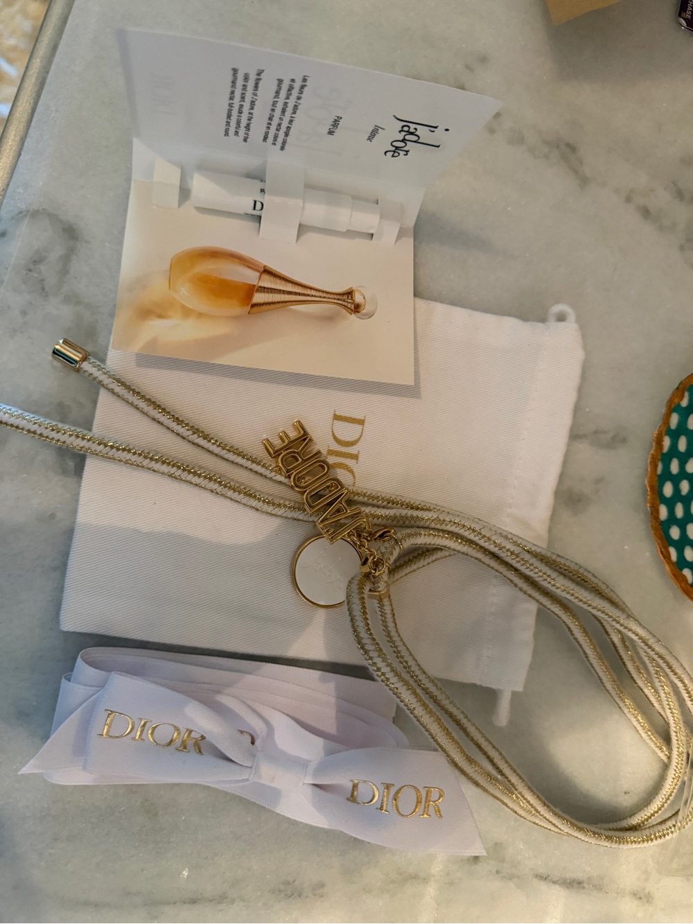 Dior phone strap with Jadore charms!  Pouch and sample also included.